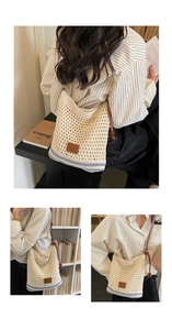 Detail of hand-woven straw tote with blue stripes and brown leather strap on model