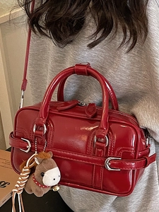 Glossy red Boston shoulder bag with silver buckle and cute horse charm for women