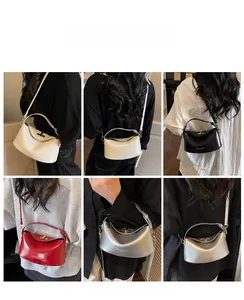 Model display of stylish half-moon crossbody bags in white, black, red and silver colors