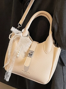 Beige solid color bucket bag with litchi grain texture, pearl charm and lace bow decor