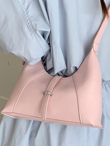 Chic pink hobo underarm bag with silver round buckle and textured faux leather finish