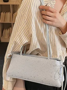 Light blue crossbody bag with star pattern and side bow accent for spring casual fashion