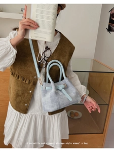 Light blue denim texture tote bag with leather handle shown in a vintage lifestyle setting