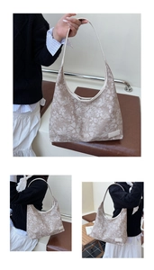 Detail of floral beige tote bag with white leather straps and side brand label