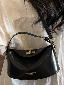 Minimalist black leather crossbody square bag for women with gold hardware and logo