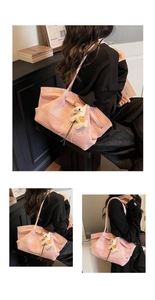 Pink checkered tote bag detail with cream leather horse charm and textured fabric finish