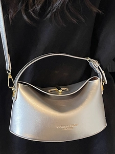 Chic silver metallic textured shoulder bag worn by model for elegant office wear