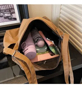 Detail view showing large internal capacity of the brown tote bag for daily essentials