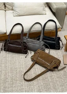 Chic tote bags in four colors featuring embossed Muon Shark logo and suede texture