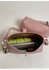 Top view of pink leather bucket bag interior showing spacious capacity for daily essentials