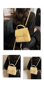 Detail showing bow-knot buckle on yellow leather backpack with star pattern texture