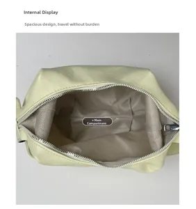Top view of large crescent bag interior with brown twill lining and silver zipper closure