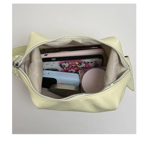 Top view of spacious cream tote bag interior showing herringbone lining and storage capacity