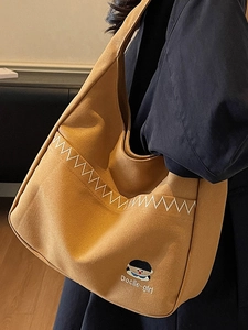 Minimalist ginger yellow canvas bucket bag with cartoon embroidery and wave stitching