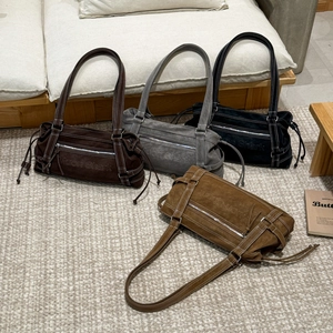 Detailed top view of four faux suede tote bags in dark brown, grey, black, and tan colors