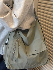 Minimalist large capacity crossbody bag in sage green with practical utility pockets