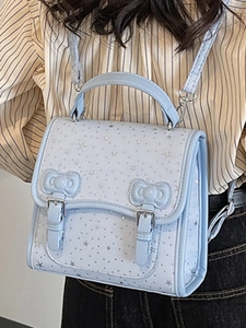 Light blue bow backpack for women with silver star patterns and faux leather finish