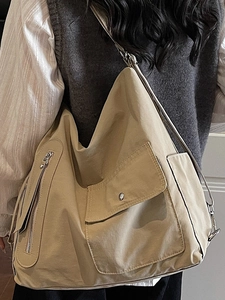 Minimalist large khaki canvas shoulder bag for women in a casual urban style