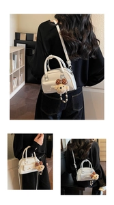 Multiple views of a white bow bowling bag with a cute teddy bear charm and strap