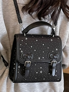Minimalist black faux leather backpack with white star pattern and silver buckle flap closure