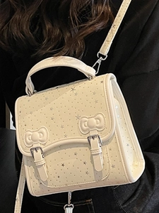 Minimalist beige crossbody bag with silver star patterns and 3D bow decorations