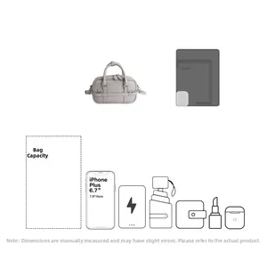 Capacité interne du sac Boston gris montrant l'espace pour smartphone de 6,7 pouces