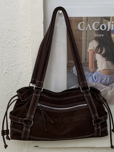 Brown canvas tote bag with contrast stitching and multi-pocket vintage cargo design