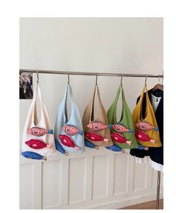 Handmade woven tote bags in five pastel colors with three 3D plush fish decorations