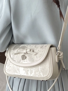 Sac bandoulière crème élégant avec nœud et pendentif cœur pour la mode printemps 2026