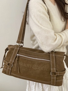 Brown suede tote bag with embossed lettering and stylish contrast stitching for women