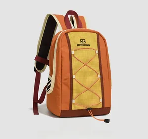 Detail view of the durable drawstring backpack with orange and brown contrast panels