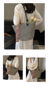 Detail of hand-woven striped tote bag with paisley silk scarf and long black shoulder straps