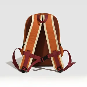 Detail of outdoor backpack padded straps and adjustable chest buckle on contrast back