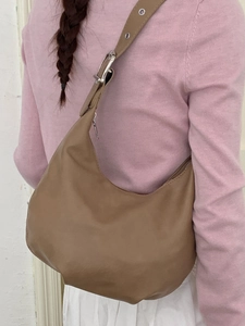 Vintage brown leather crescent dumpling shoulder bag with adjustable silver buckle strap