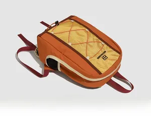 Detail of orange drawstring backpack with yellow mesh and black side water bottle pocket