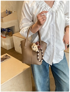 Brown litchi leather bucket bag with cute teddy bear and polka dot bow detail