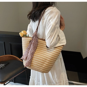Straw tote bag with brown paisley scarf and tulips shown in a lifestyle setting