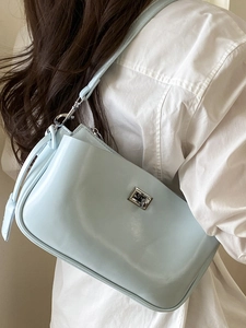 Elegant light blue baguette shoulder bag with silver metal lock for a minimalist style
