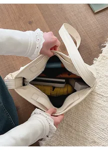 Detail view of the large capacity tote bag interior with multiple daily items storage
