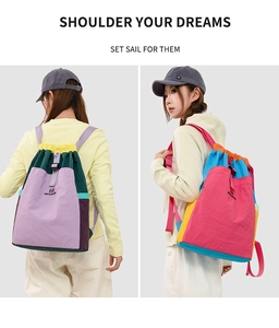 Detail view of the colorful拼接 nylon backpack featuring drawstring and side profile design
