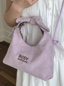 Chic purple suede basket bag with knotted handle and elegant striped lining