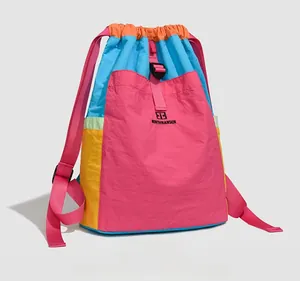 Detailed side view of colorful nylon backpack showing multi-color patchwork and logo