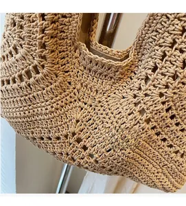 Detail of hand-woven hollow pattern and matching inner lining on khaki beach tote bag