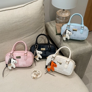Chic woven Boston bags in four colors with gold zippers and decorative horse charms
