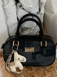 Chic black and grey plaid Boston handbag with leather trim and a horse charm