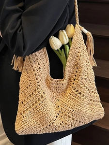 Handmade woven crochet tote bag in khaki with hollow knit patterns and long side tassels
