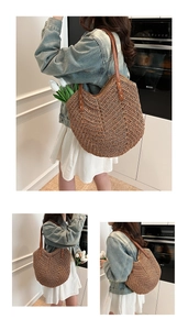 Detail of woven straw tote bag with brown leather straps and sturdy rivet details