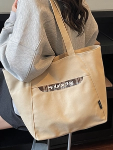 Grand sac cabas chic en toile beige avec poche à carreaux marron pour un usage quotidien