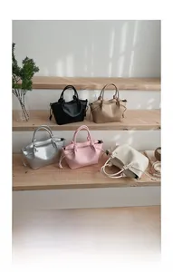 Detailed view of bucket bags in five colors with drawstring and knot handles