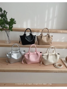 Collection of versatile bucket bags in five colors on a wooden stairs background